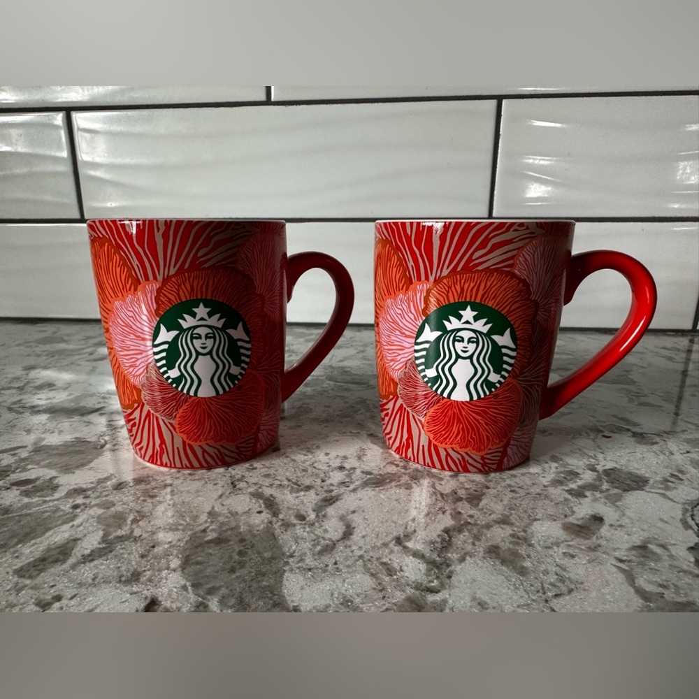 Set of 2 Starbucks red and orange print coffee mugs. Brand new, never used.
